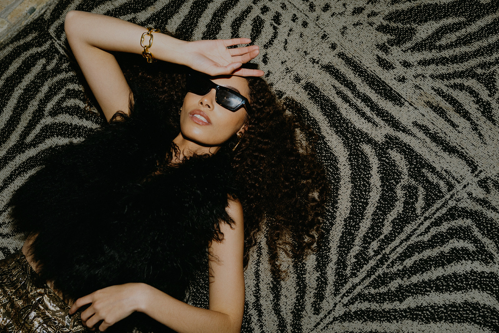 Woman in Glasses Relaxing on Bed